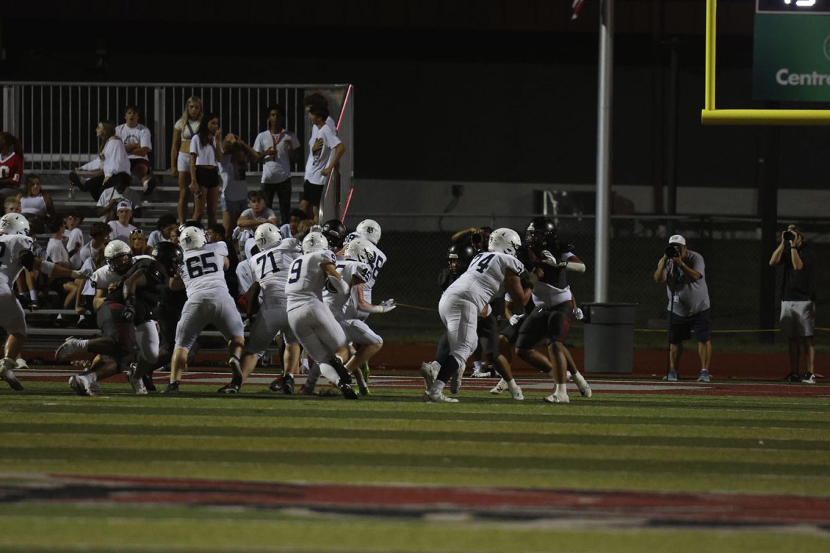 Max Piva runs the ball though the pocket to the end zone.
