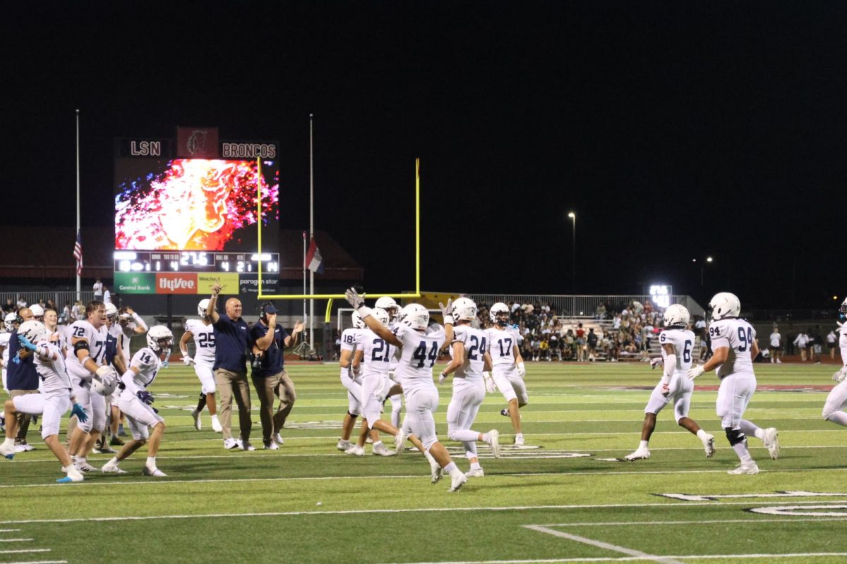 Junior Ryder Farley celebrates after a touchdown in the fourth quarter against Lee Summit North on Thursday, Sept. 10. 