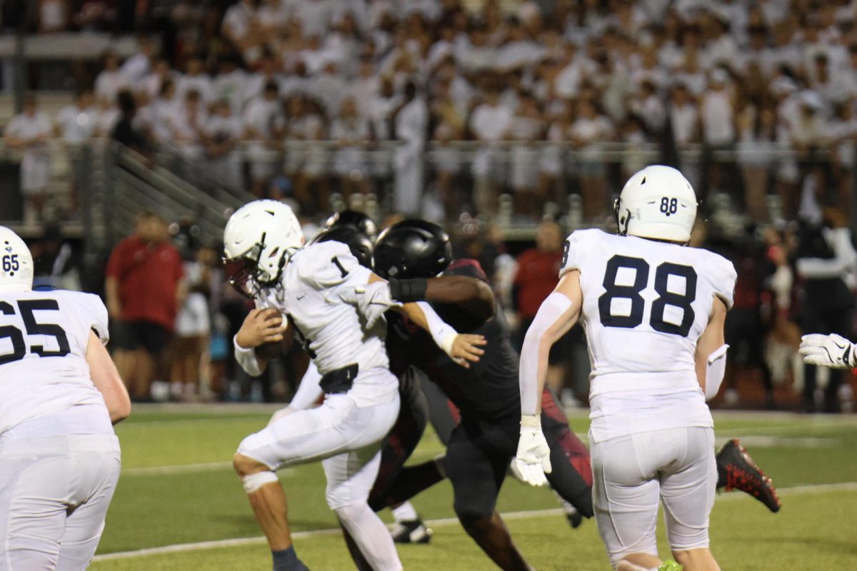 Senior Blake Jay runs the ball to get a first down on Thursday, Sept.10, against Lee Summit North. 
