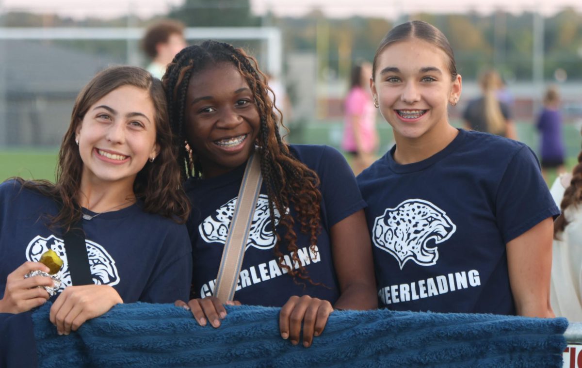 sophomores cortlyn peterson and Brynann king and freshman Eva Jenkins showing there pride for there friends 