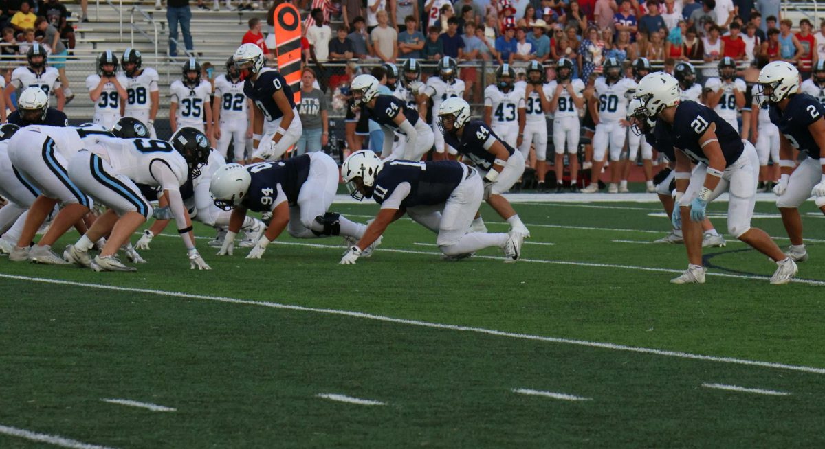 Ready on defense, the players prepare for the snap.