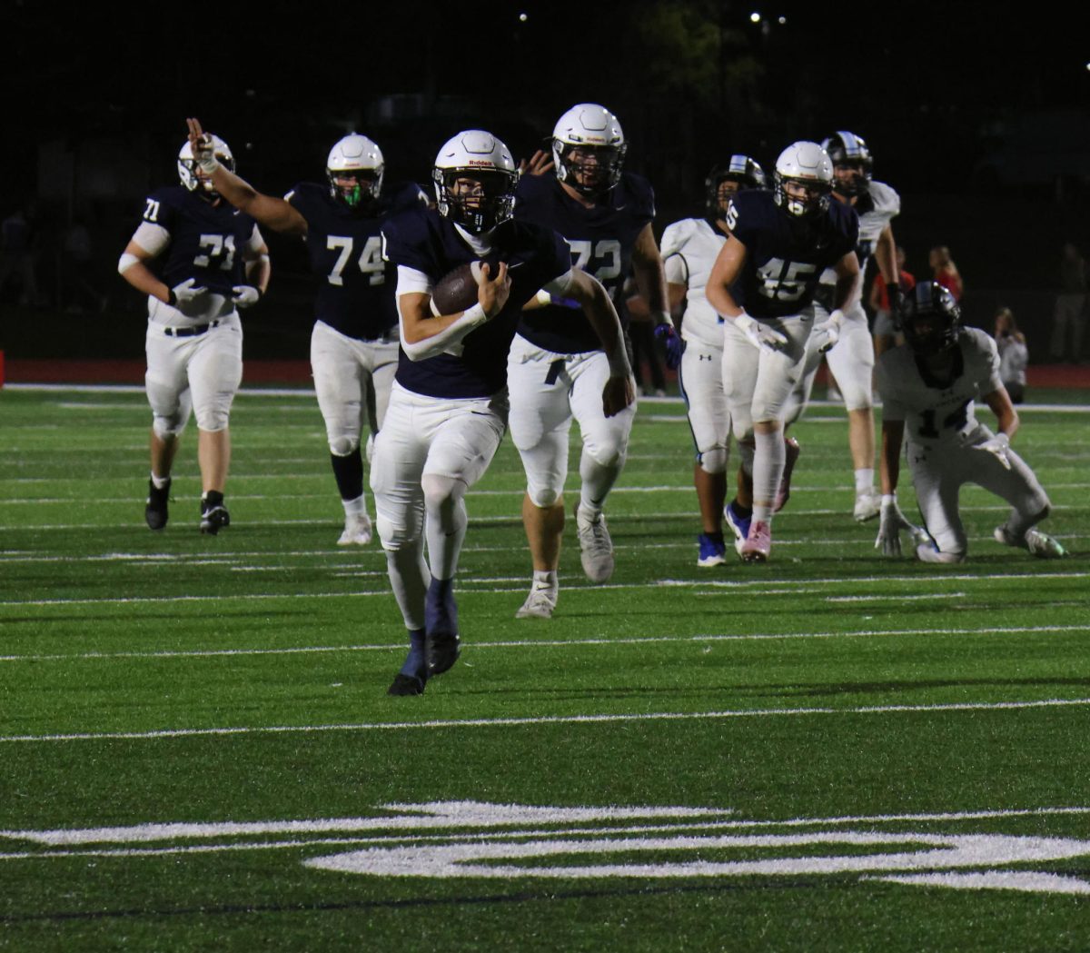 Running towards the end zone, senior Blake Jay scores his third touchdown of the game.