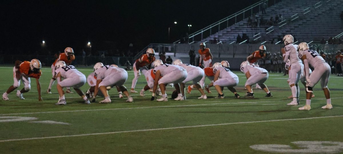 Preparing for the snap, the offense gets in formation.