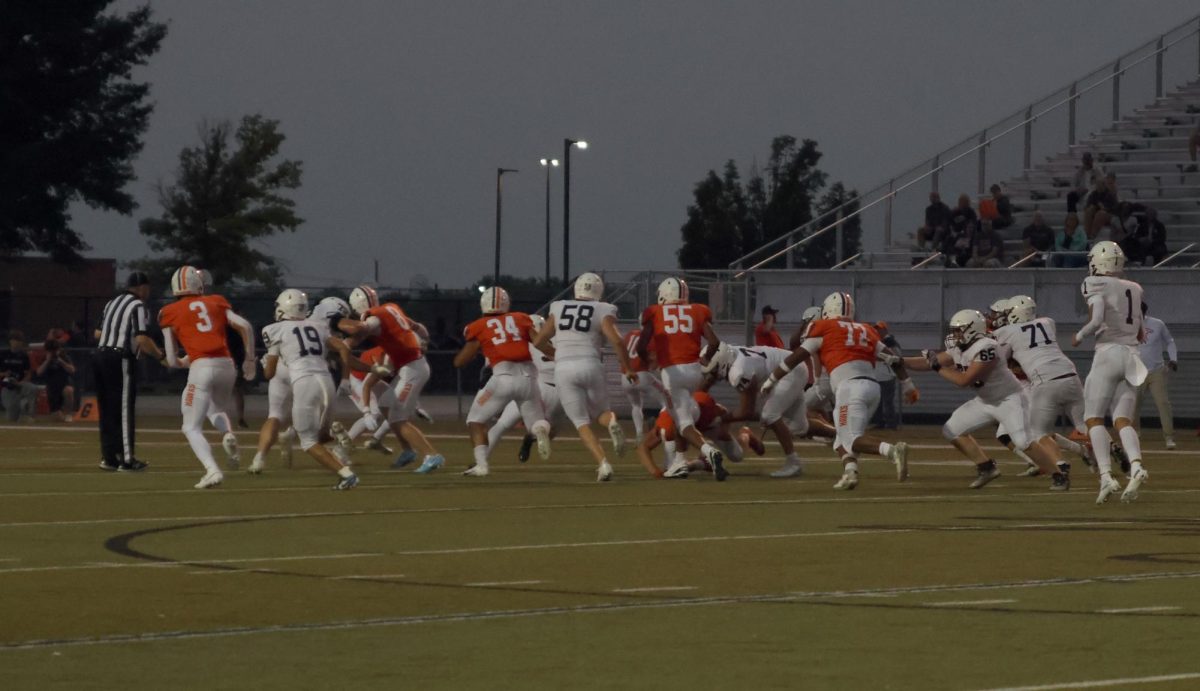 The Jaguar defense attacks the offense after Olathe East snaps the ball.