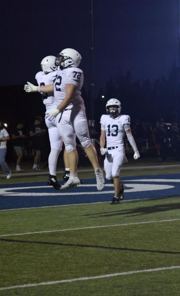 Junior Max Piva and senior Nick Philhour celebrate after another Jaguar touchdown.