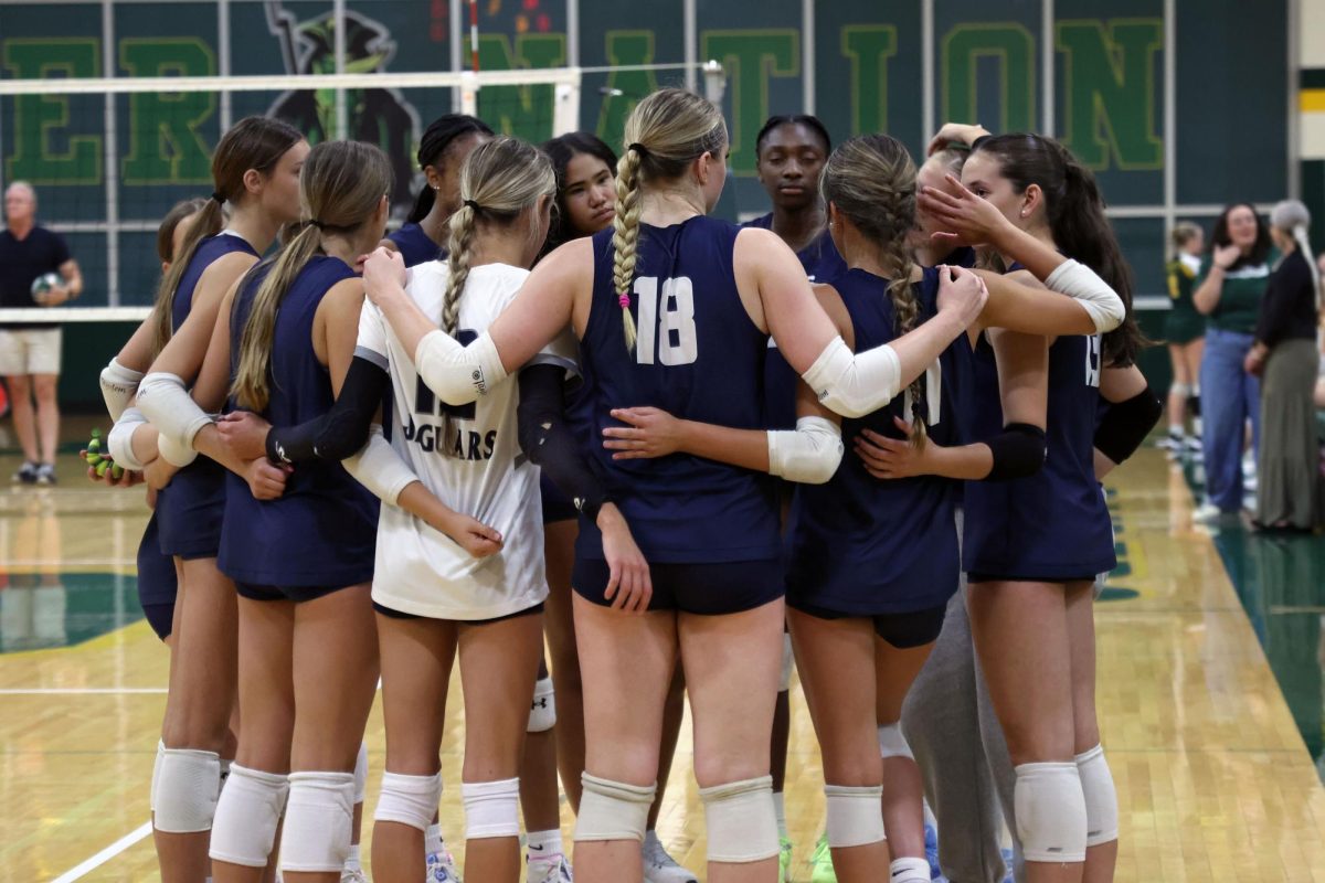 After the game, the team huddles up and talks about their win. 
