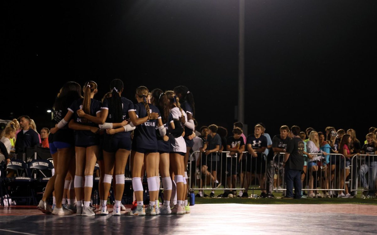 During a timeout, the Jags huddle up as Coach Corneliusen talks to them about what to do next.
