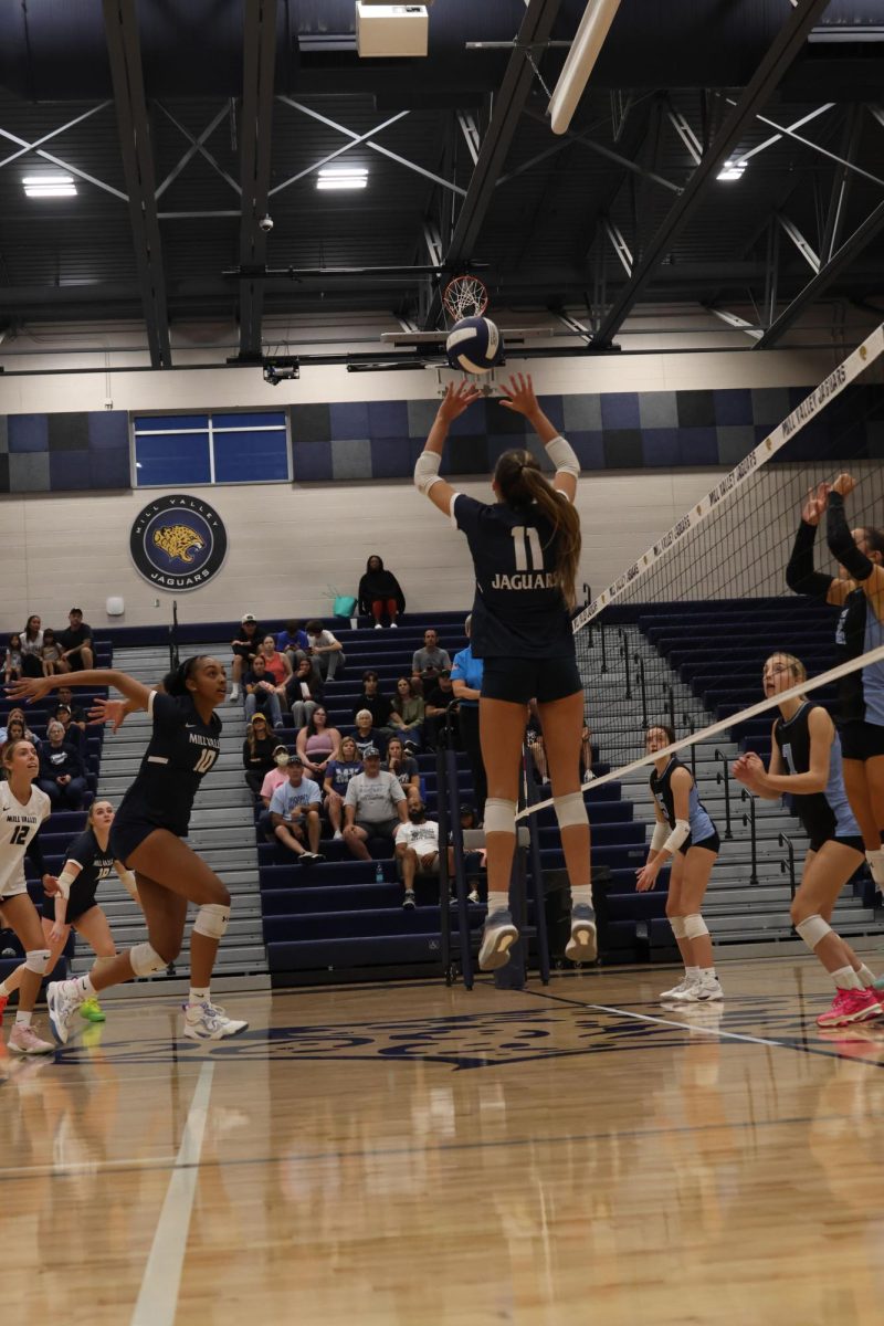 Preparing to hit senior Leilah Perry, gets ready for the set by senior Ella Florez.