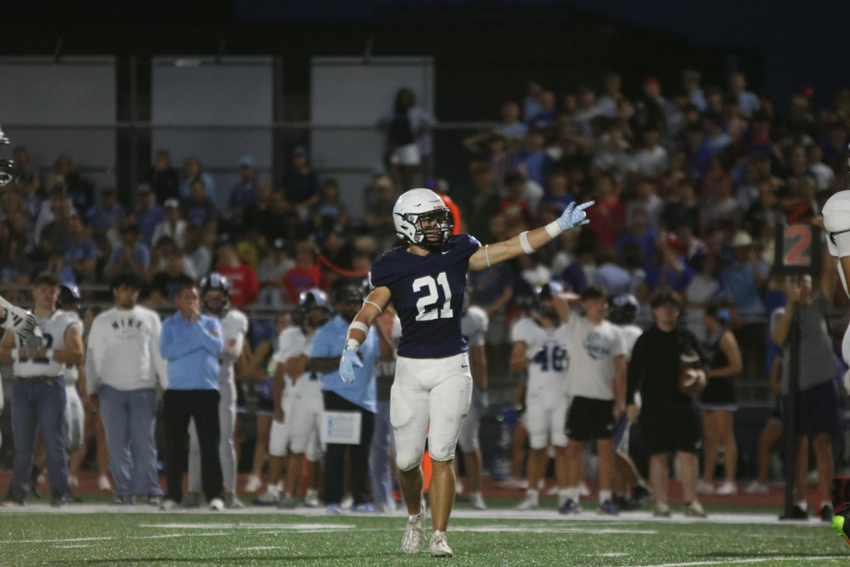 Senior Landon Stockwell celebrates after the Jaguars gain possession of the football