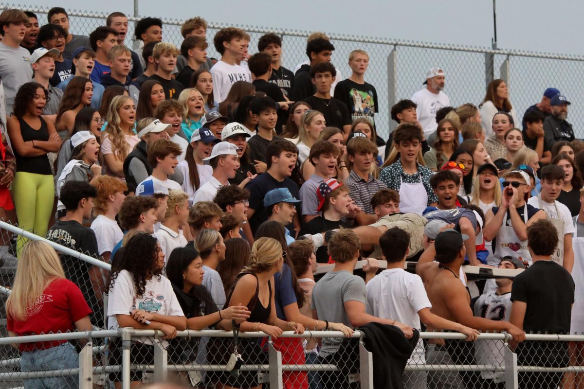 Senior Lucas Isenberg energizes the student section 