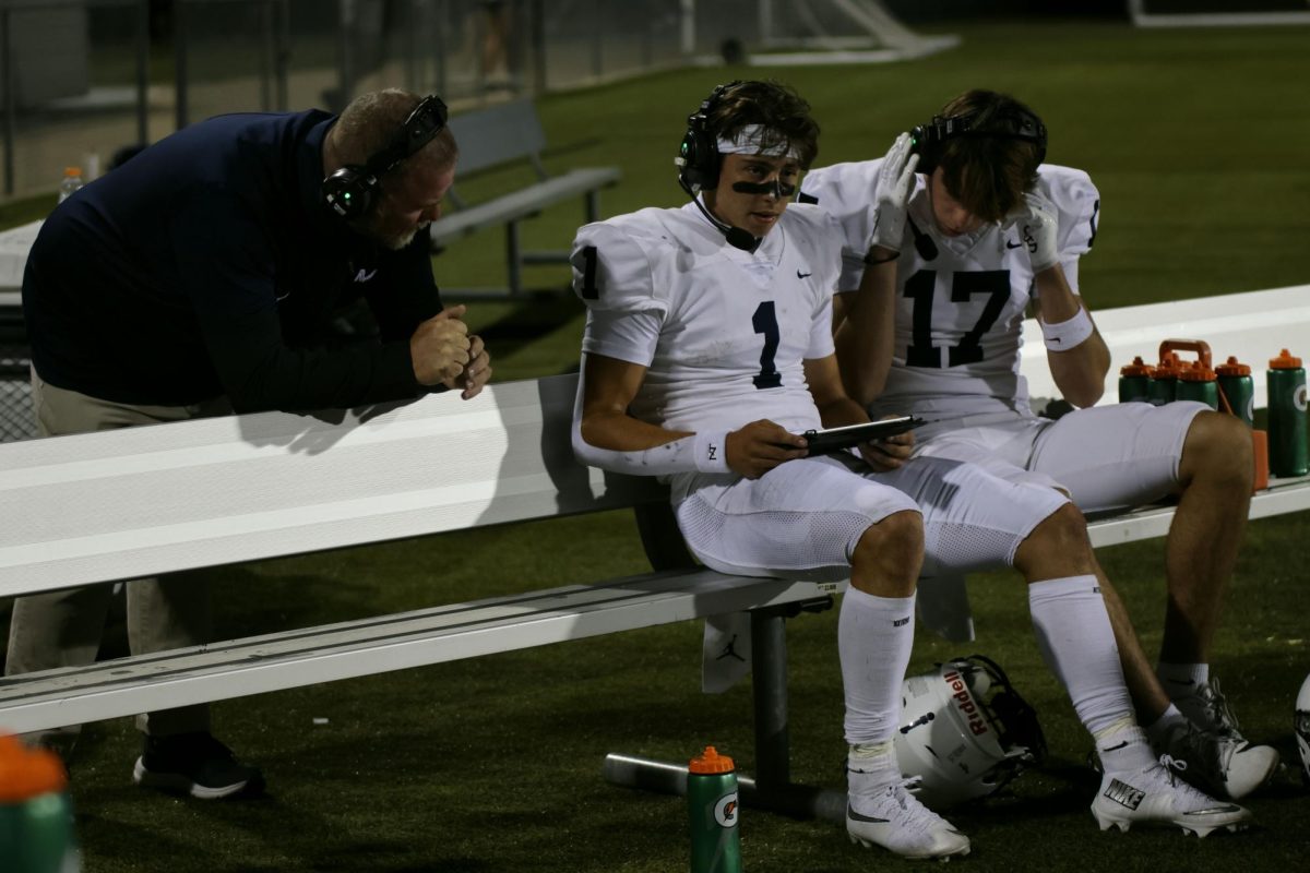 reviewing film senior Blake Jay takes advice from his coacn