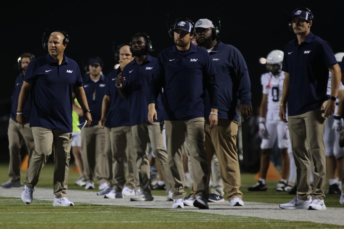 Coach Joel Applebee waiting to call the next play 