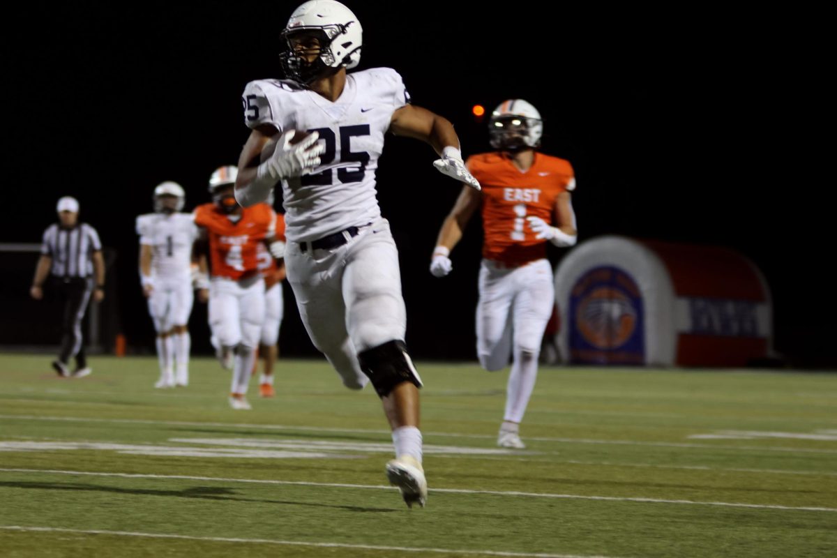 Senior Reggie Reece runs in the ball for his second touchdown of the night 