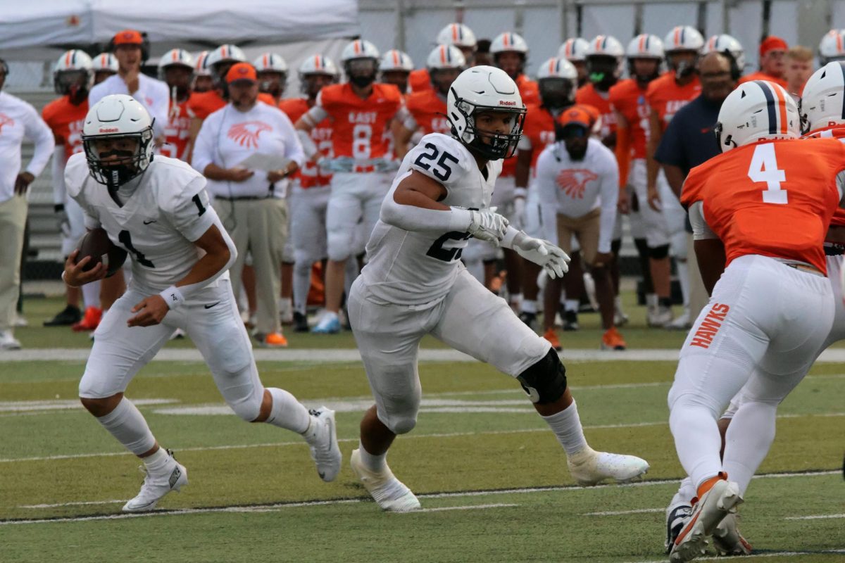 Running the football Senior Blake Jay escapes the defense 