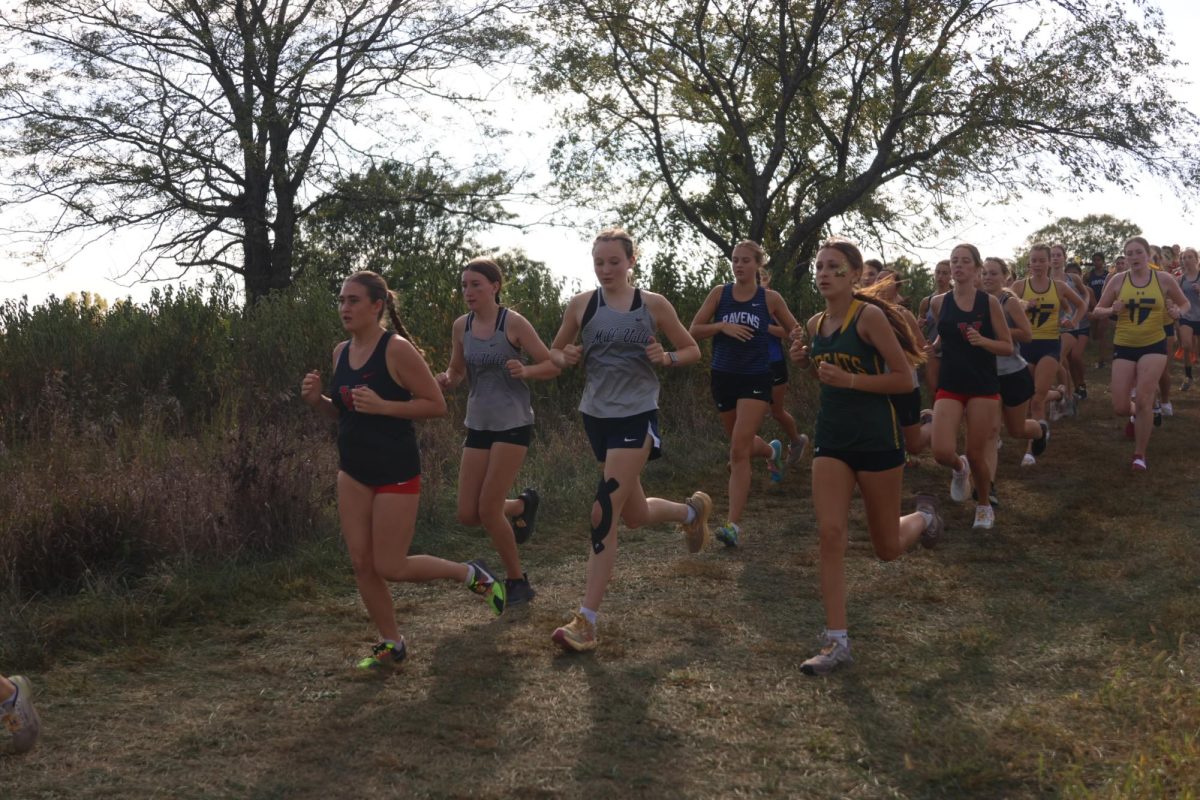 Freshman Rylee Hugart and sophomore Addi Richter pair together while they run the course.