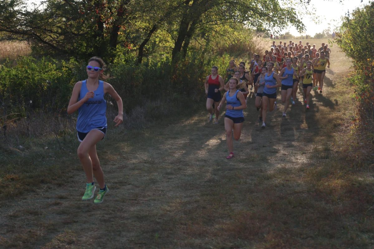 Sophomore Lindsey Maxwell leads the pack, followed by seniors Kylie Stegner, Mae Reynolds and junior Taylor Parks.