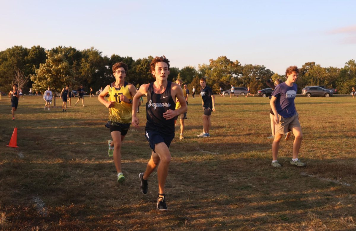 Senior Carson Curry races to stay ahead of his opponent. 
