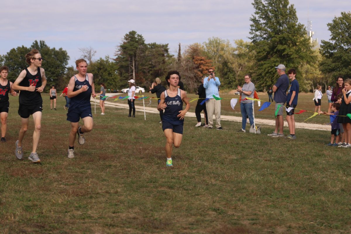 Freshmen Lucas Lowry and Brooks Eylar quicken their speeds as they near the finish.