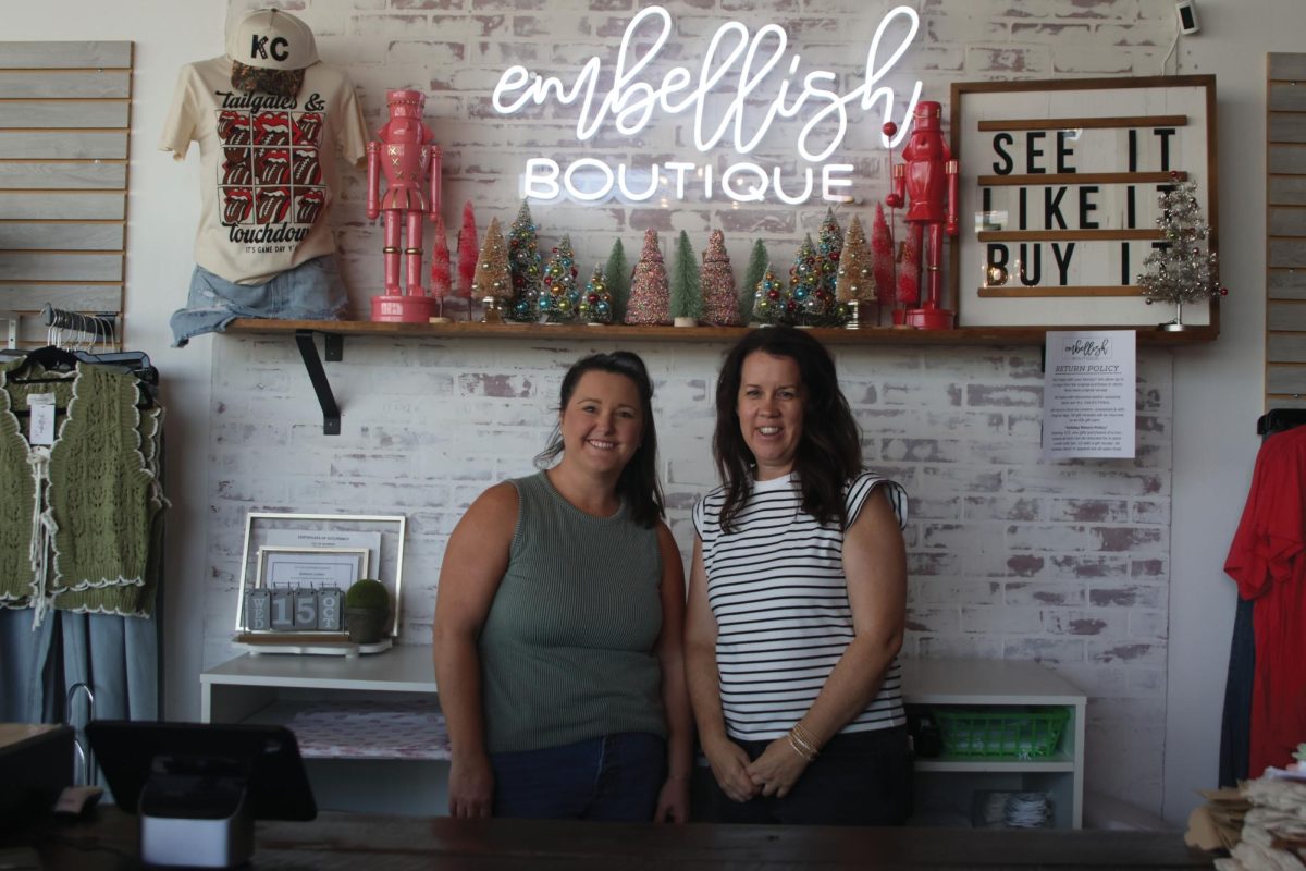 Standing behind the counter, Embellish Boutique co-owners Amanda Hamilton and Lindsay Wake wait for customers to arrive, Wednesday Oct. 15. 