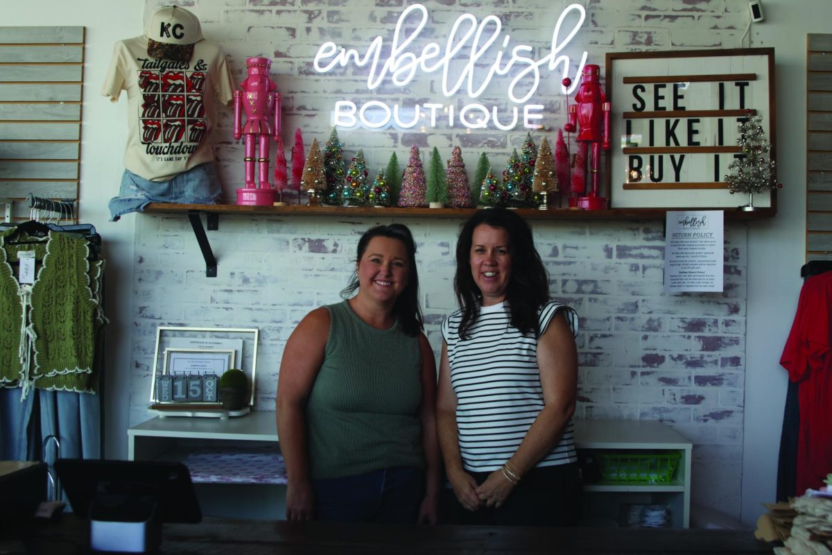 Standing behind the counter, Embellish Boutique co-owners Amanda Hamilton and Lindsay Wake wait for customers to arrive, Wednesday Oct. 15. 