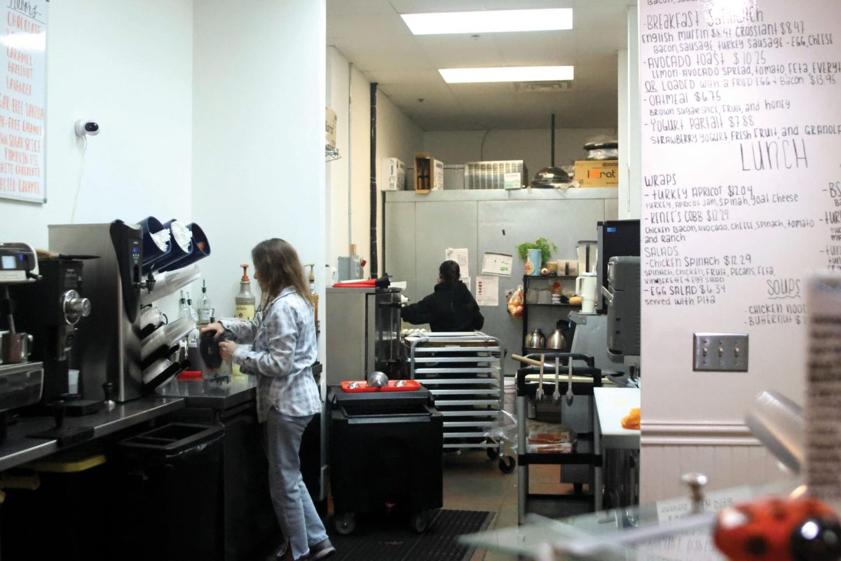During her morning shift, Prayer Box Cafe owner Katie Bolen works on making a blended frozen lemonade for one of her customers, Wednesday Oct. 15.  
