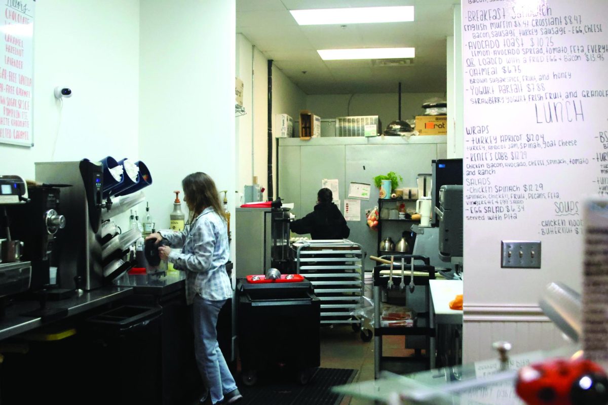 During her morning shift, Prayer Box Cafe owner Katie Bolen works on making a blended frozen lemonade for one of her customers, Wednesday Oct. 15.  