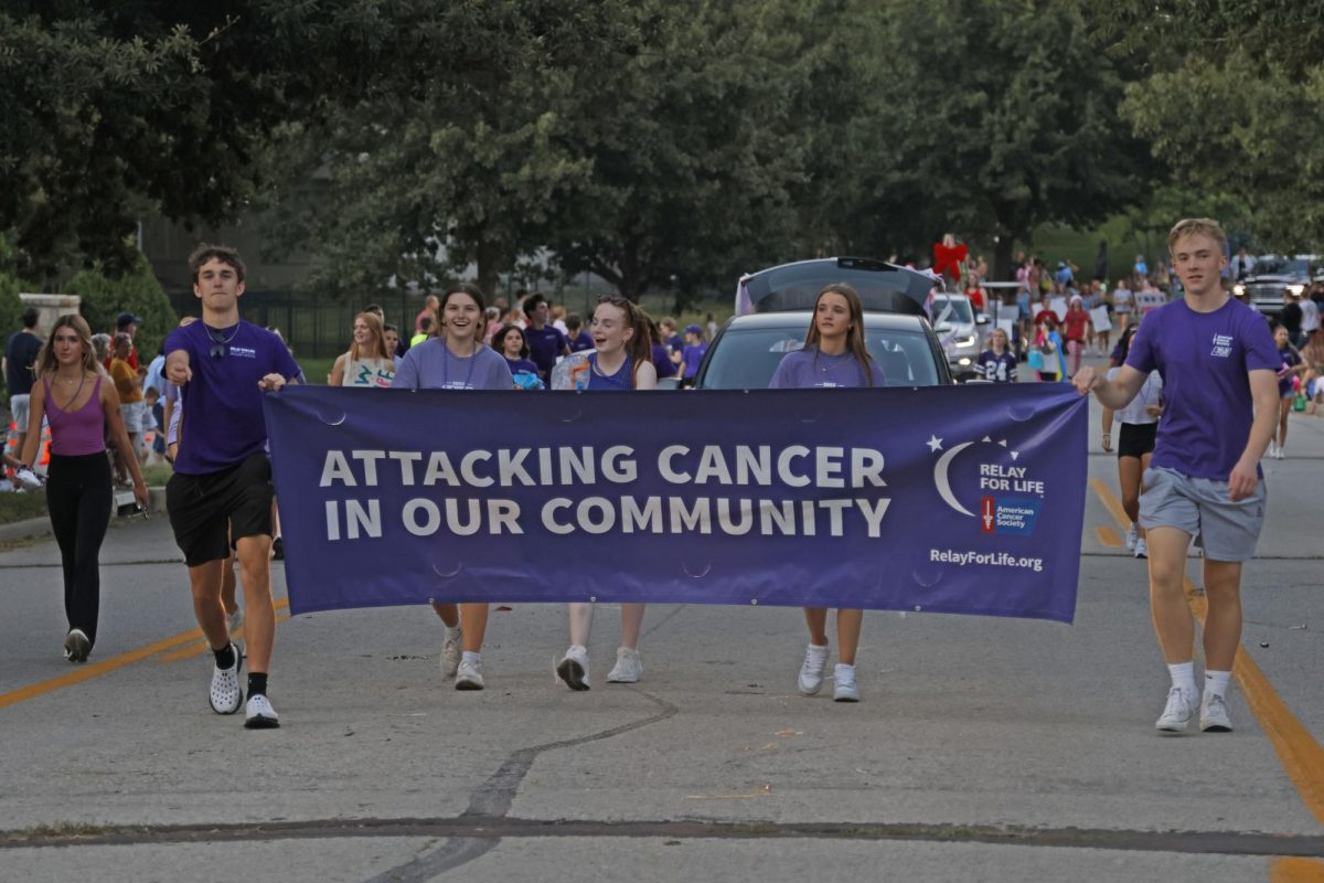 During the homecoming parade on Oct 1, 2025, Sophomores Finn Hannon, Nora Claycamp, Quinn Slattery Elin Diskin, and Calton Bierl all walk carrying the Relay for Life banner to represent the mission of attacking cancer.  