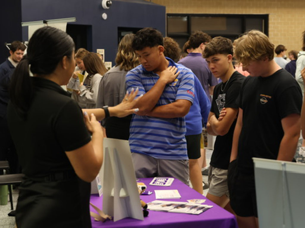 Junior Josh Garcia and Ben Reed learn about Grand University and the opportunities available there.