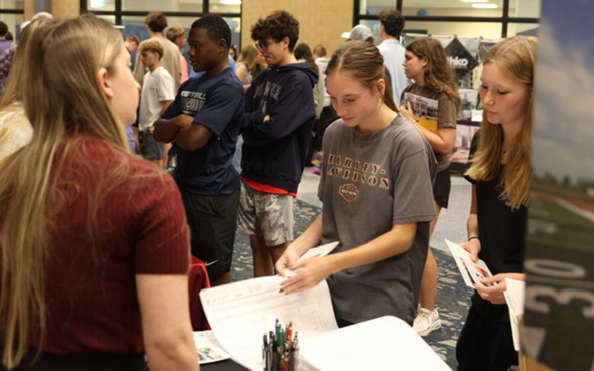 Students Adelyn Randal and Rylee Slaven look at HTK Architects and learn what it is about. 
