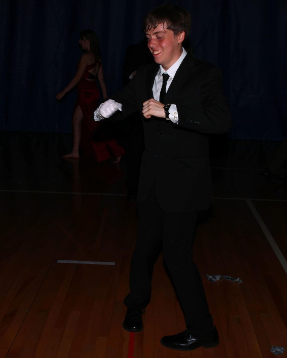 Junior Blayne Chrisman, grooves along to the music.
