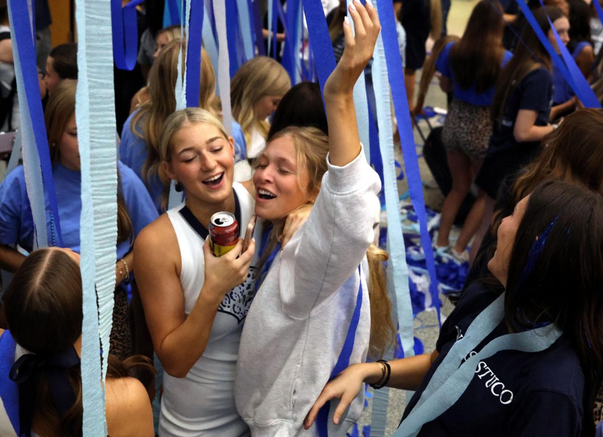 Singing together, seniors Bryn Foltz and Callaway Cliftion sway to the music.
