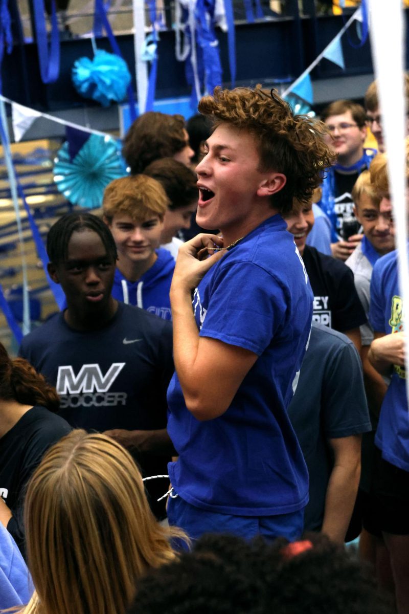 Senior Gavin Hurt jumps in the air, hyping everyone up.