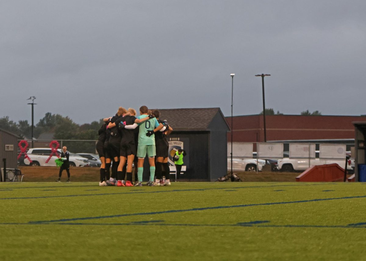Before the start, the Jags huddle for one last pregame talk.