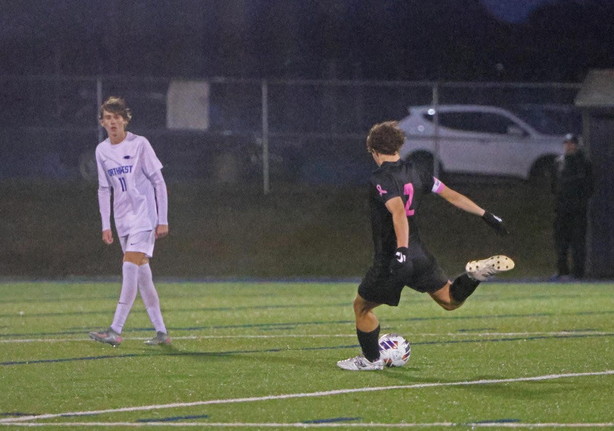 On the free kick, senior Landon Vincent takes the kick to try and create a scoring chance.