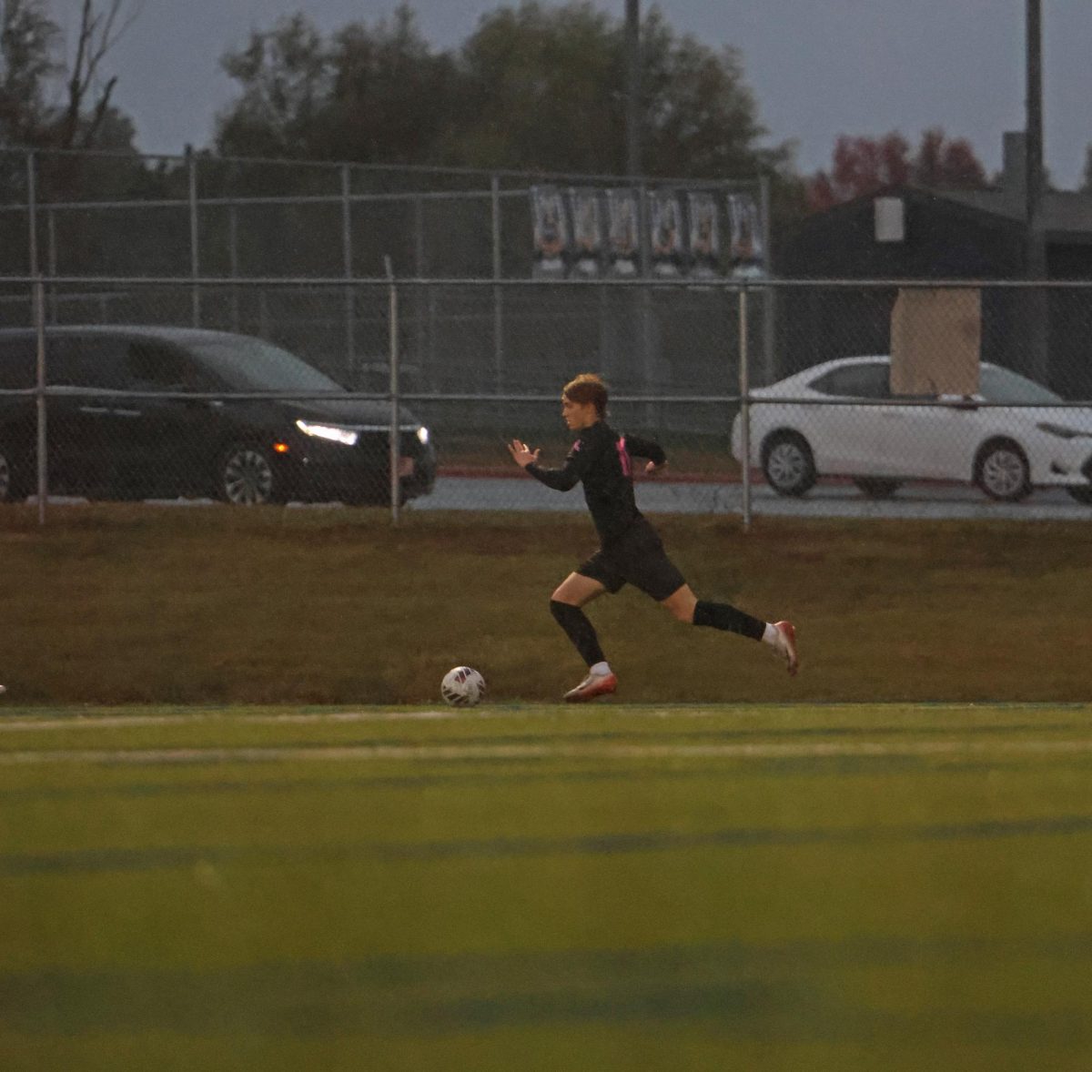 Going up the field, senior Ethan Walter helps set up the offense.