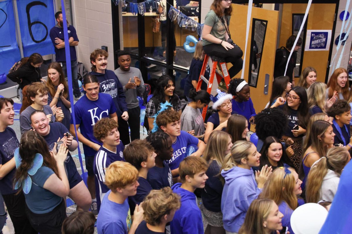 Enjoying the Blue Bomb festivities, the group of seniors sing and clap to the music. 