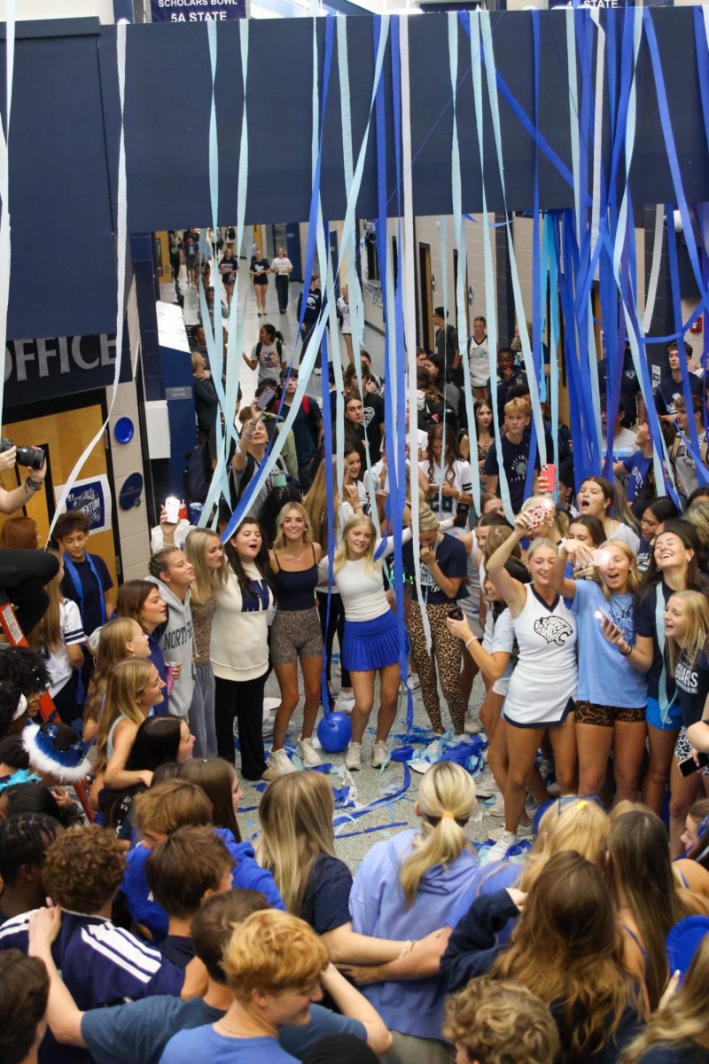 Standing in a circle, seniors sing and encourage one another. 
