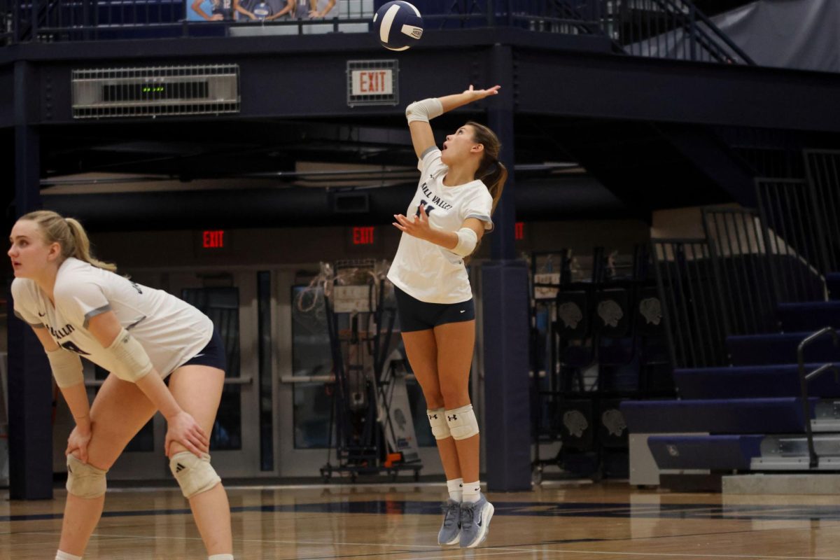 Senior Ella Flores serves her final serve of her run on Thursday Oct 2.
