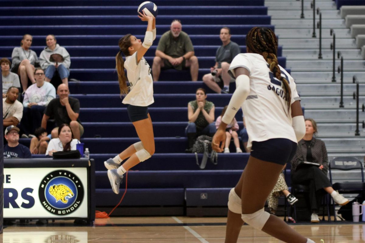 Senior Ella Flores sets the ball to her teammates on Thursday Oct 2.
