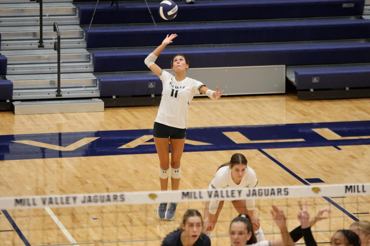 Senior Ella Flores serves the volleyball to the opposing offense on Thursday Oct 2.
