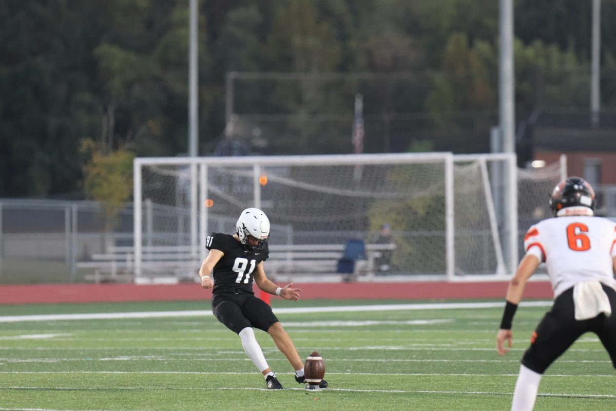 Mason Gallender kicks during the first quarter against shawnee mission northwest on fri. oct. 3rd