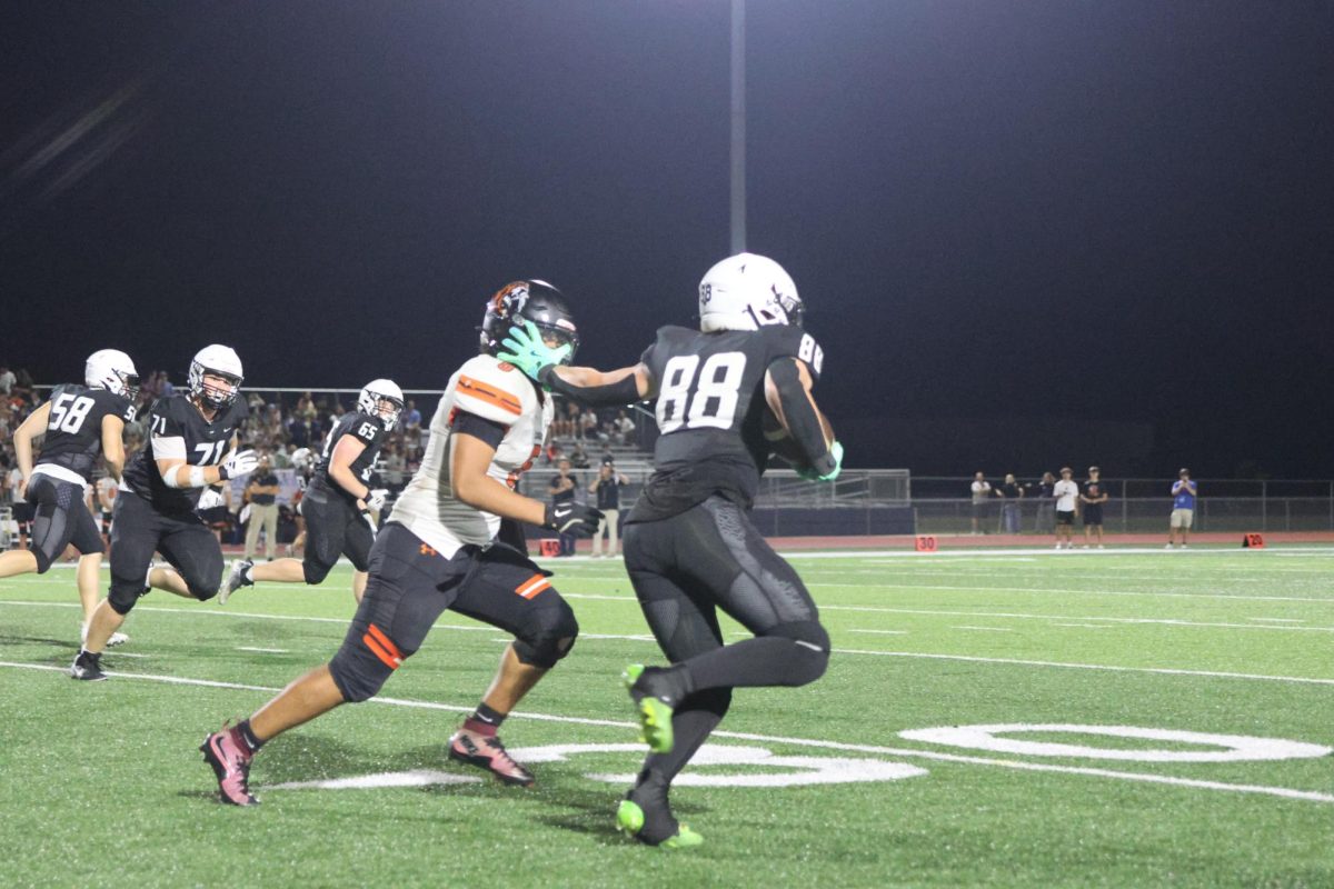junior Stone Zambo runs to get a first down against Shawnee mission northwest on fri. oct. 3rd.