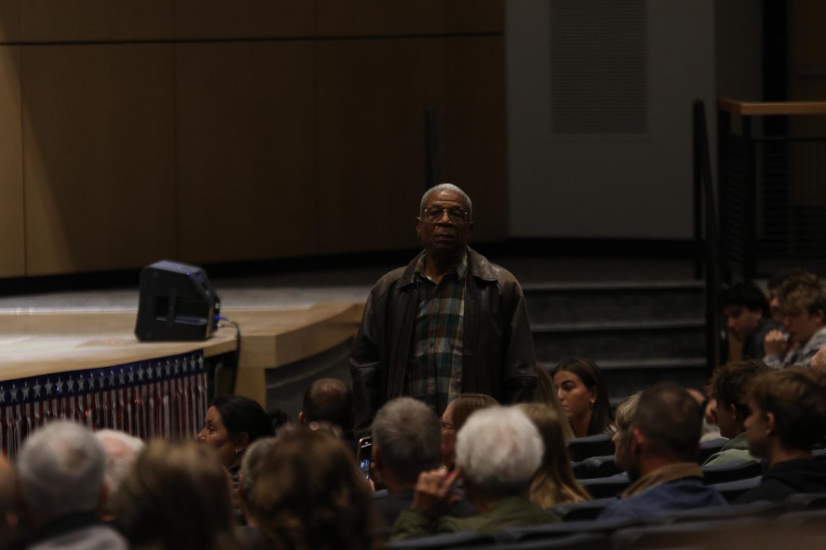 A veteran stands in front of the crowd with honor.