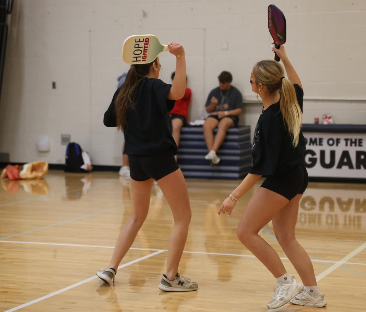 To commemorate their success, junior Avery Royer and senior Claire Cooper celebrate after an amazing play.