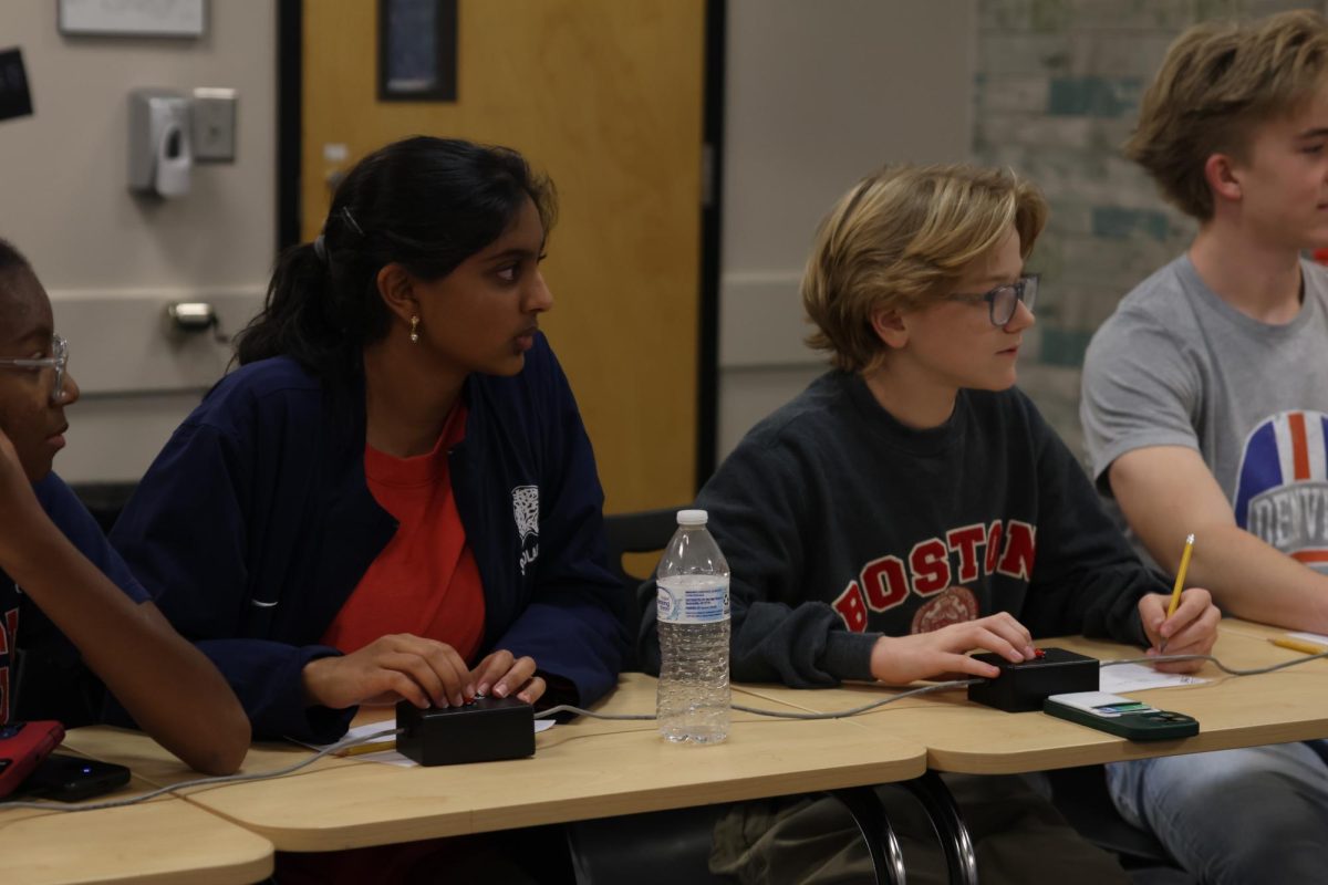 Waiting intently, sophomores Shriya Mihir and Asher Clement prepare for the next question to be read during Scholars Bowl practice on Friday Nov. 7. 