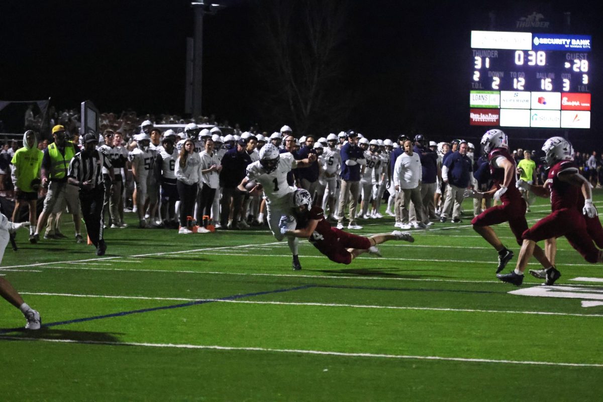 Senior Blake Jay gets tackled after a play. 
