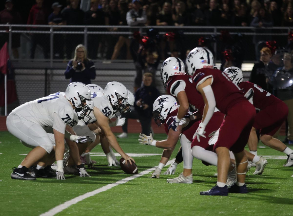 The team gets ready for the next play.
