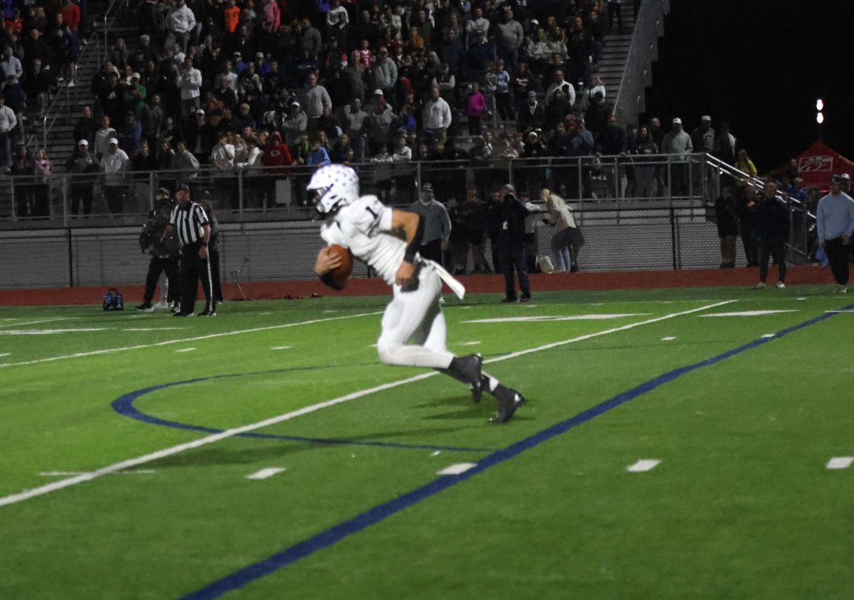 Senior Blake Jay runs the ball down the field.
