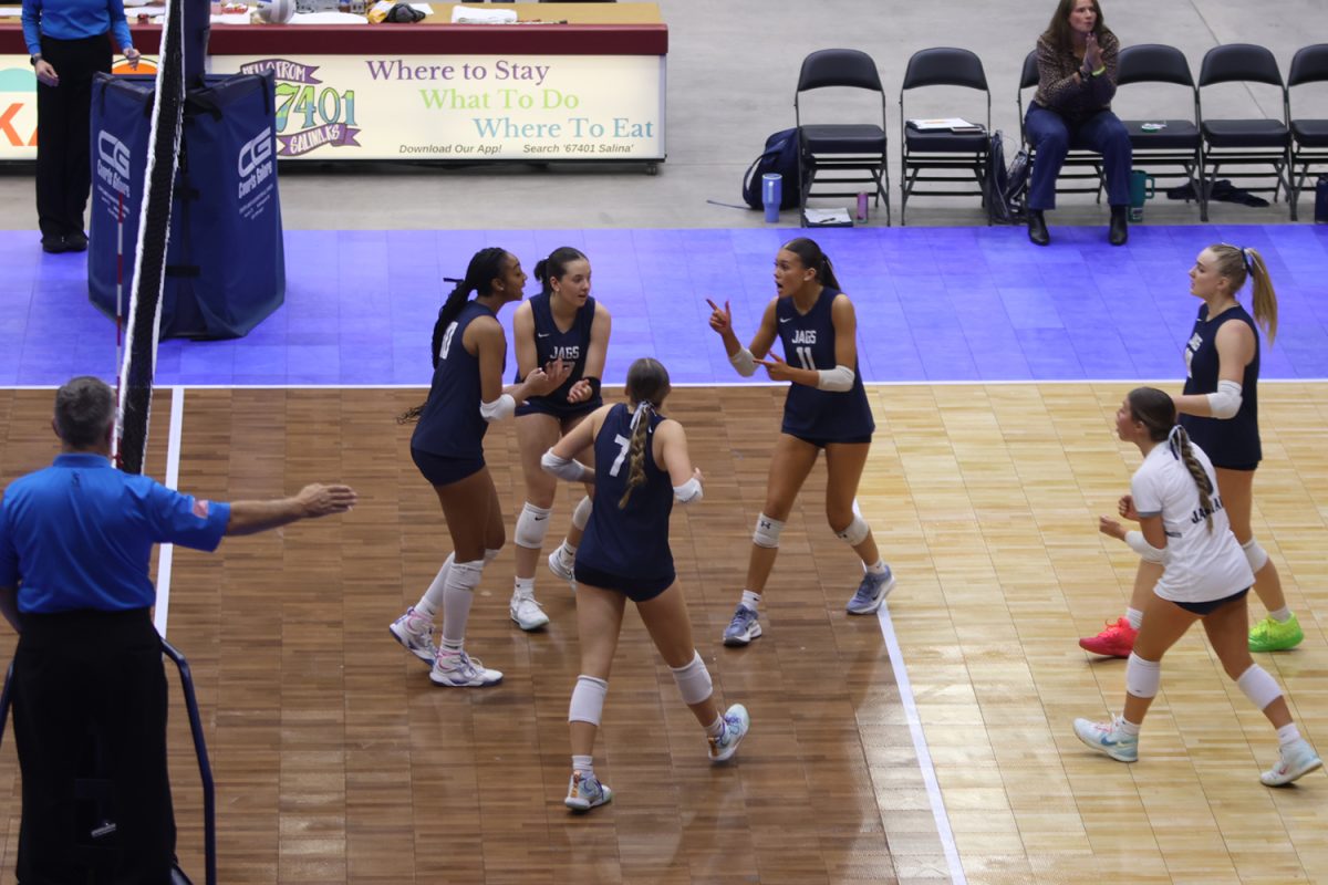 The Jags celebrate a point against Blue Valley West in the state semifinal match.