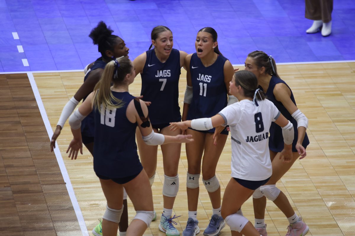 In the state third place match, the team celebrates a point against Olathe Northwest Saturday, Nov. 1. The Jags beat the Ravens, 2-1.